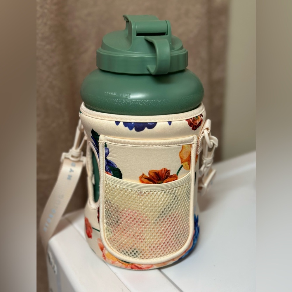 Green Hydro jug with floral sleeve.